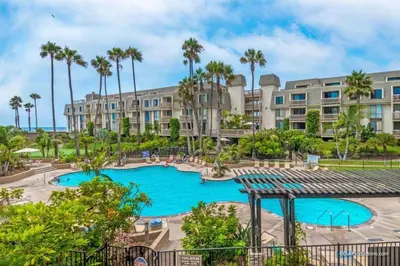 an image of a pool at a resort at North Coast Village Penthouse A306 in Oceanside