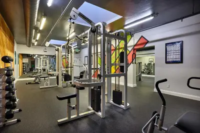 a gym with several treadmills and machines at North Coast Village D204 in Oceanside