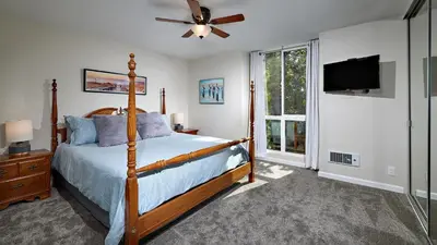 a bedroom with a bed and a ceiling fan at North Coast Village Cottage G20 in Oceanside