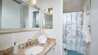 a bathroom with a sink and a shower at North Coast Village Cottage G20 in Oceanside