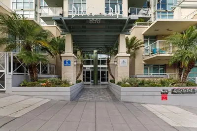 a building with palm trees in front of it at 3BR Downtown Peaceful Corner in San Diego