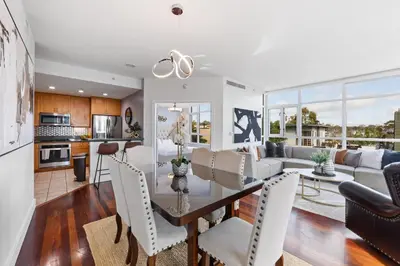 a dining room and living room with a table and chairs at 3BR Downtown Peaceful Corner in San Diego