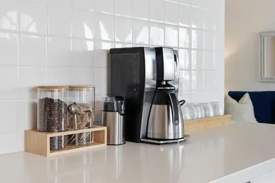 a coffee maker sitting on top of a counter at Oceanview Mission Beach Compound, Balcony, Patio, Fire Pit, BBQ, Steps to Sand in San Diego