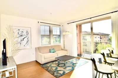 a living room with a couch and a table at Stylish 2BR Foothill Escape in Irvine in Lake Forest
