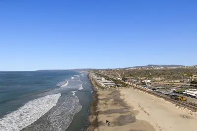 an aerial view of a beach and the ocean at Walk to the Beach Wedding Venues Downtown Del Mar AC in San Clemente