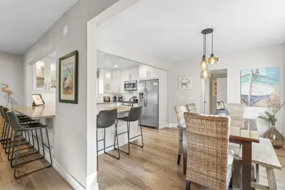 a kitchen and dining room with a table and chairs at Hideaway A Walk to the beach Downtown AC in San Clemente