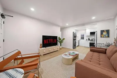 a living room with a couch and a tv at Modern 2BR in Prime Location with Board Games in San Diego