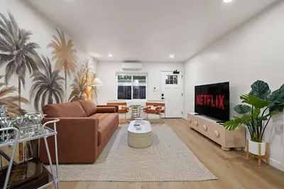 a living room with a couch and a tv at Modern 2BR in Prime Location with Board Games in San Diego