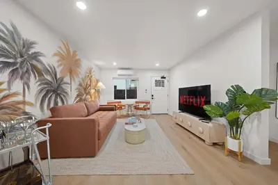 a living room with a couch and a tv at Modern 2BR in Prime Location with Board Games in San Diego