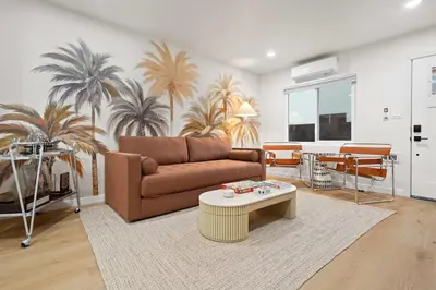 a living room with a couch and a table at Modern 2BR in Prime Location with Board Games in San Diego