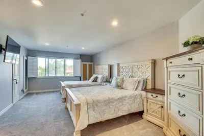 a bedroom with two beds and a dresser at Spectacular Ocean View! Luxe Condo in San Clemente in San Clemente