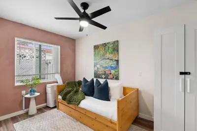 a bedroom with a bed with a ceiling fan at Pacific Beach Paradise-Walk to Beach &Bay in San Diego
