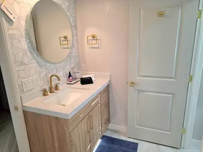 a bathroom with a sink and a mirror at Modern Residence with Mountain Views in Escondido