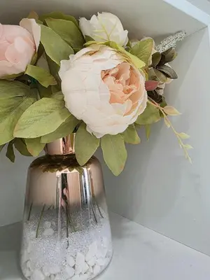 a vase with pink roses in it on a table at Sunny 5BEDR00MS with Pool, Zip Line, Game Room, Kid's Playhouse in San Diego
