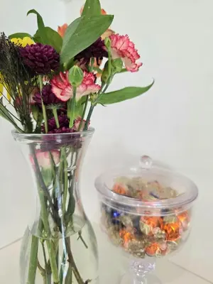 a vase filled with flowers and a container of rocks at Sunny 5BEDR00MS with Pool, Zip Line, Game Room, Kid's Playhouse in San Diego