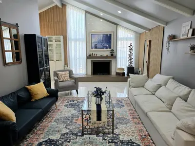 a living room with a couch and a table at Sunny 5BEDR00MS with Pool, Zip Line, Game Room, Kid's Playhouse in San Diego