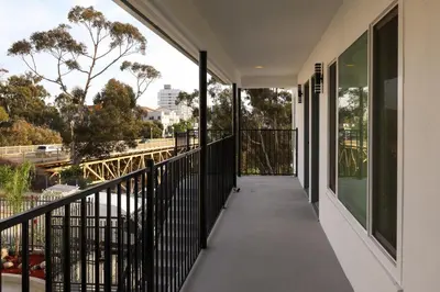 an empty balcony with a view of the freeway at Cozy Studio Near Balboa Park in San Diego