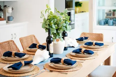 a dining room table with a blue table cloth and chairs at La Jolla Oasis - Spa, Sauna, Beach, Shops, UCSD in San Diego