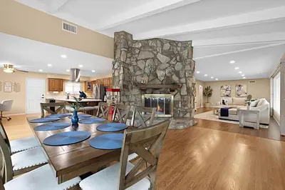 a dining room with a table and a stone fireplace at Serene 4BR La Mesa Hideaway in La Mesa
