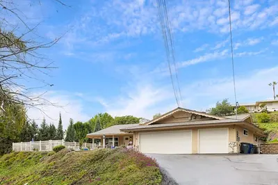 a house with a garage in front of it at Serene 4BR La Mesa Hideaway in La Mesa