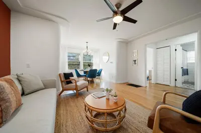 a living room with a couch and a table at Little Italy Home with Parking and Backyard in San Diego