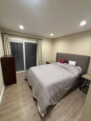 a bedroom with a large bed and a window at Nice home in Irvine