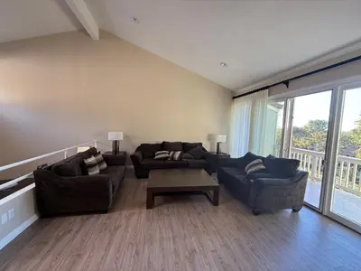a living room with two couches and a coffee table at Nice home in Irvine