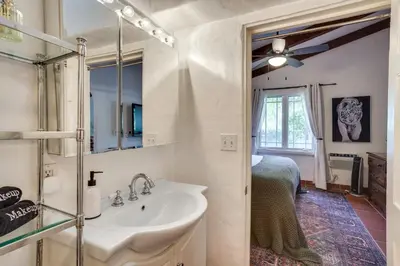 a bathroom with a sink and a mirror at Romantic Retreat at Rancho Las Lomas Pet Friendly