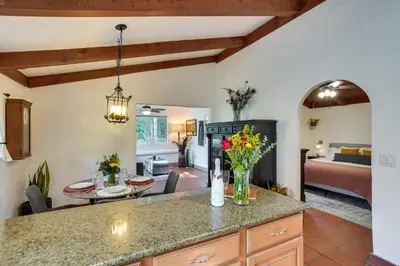 a kitchen with a table and a living room at Creative SoCal Escape! Trabuco Canyon Casita