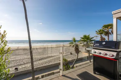 a view of the beach from the balcony of a condo at Casa Azul at Mission Beach Oceanfront Getaway in San Diego