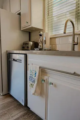 a kitchen with a sink and a dishwasher at 2 Bdr 2 bath luxury home steps away from Mission Beach 5 min from Belmont in San Diego