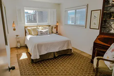 a bedroom with a bed with a pillow on it at 2 Bdr 2 bath luxury home steps away from Mission Beach 5 min from Belmont in San Diego