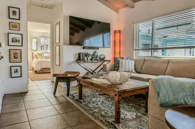 a living room with a couch and a table at 2 Bdr 2 bath luxury home steps away from Mission Beach 5 min from Belmont in San Diego