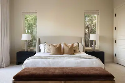 a bedroom with a large bed with two windows at ResortHome Pickle Ball Pool MovieRoom Gym Sauna Villa in Del Mar