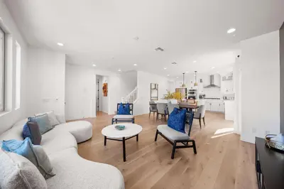 a living room with a couch and a table at Marbella Lane - Curated 5BR in Upscale RMV Haven in Ladera Ranch