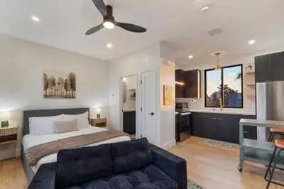 a bedroom with a bed and a couch at Private Studio - Stylish Cozy & Central in San Diego