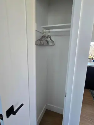 a closet with a white door with hangers at Private Studio - Stylish Cozy & Central in San Diego