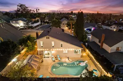 an aerial view of a house with a swimming pool at Entire Private Home with 4 Bedrooms 2 Bathrooms Garage, Pool, King Bed, Gated Yard in Rancho Penasquitos, Available Now in San Diego