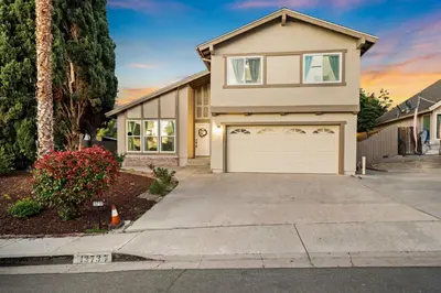 a house with a driveway and a garage at Entire Private Home with 4 Bedrooms 2 Bathrooms Garage, Pool, King Bed, Gated Yard in Rancho Penasquitos, Available Now in San Diego