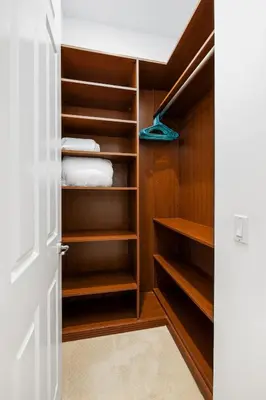 an open door to a closet with wooden shelves at Ocean View 4 Bedroom Home in Carlsbad