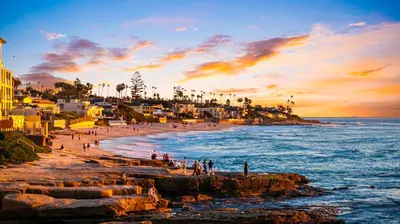 a group of people on a beach at sunset at La Jolla Studio - Private Beach in San Diego