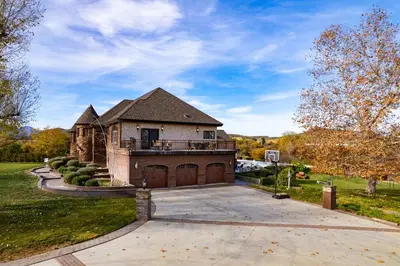 a large house with a large driveway at Indoor Pool & Spa - Gym - Sauna - Pickleball Court in Perris