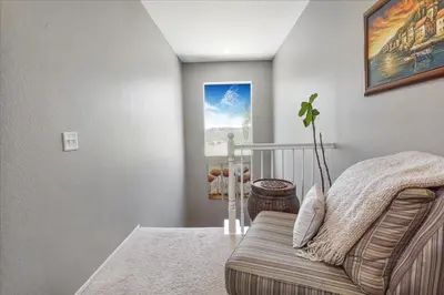 a living room with a couch and a plant at Your Home Away From Home near Wineries & Old Town in Murrieta