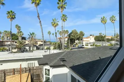 a roof view of a parking lot with palm trees at One Block to Beach 4BR Game Room and Parking in San Diego