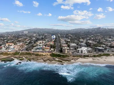 an aerial view of a beach with buildings and the ocean at Ocean Paradise | Patio, Parking, BBQ, Location! in San Diego