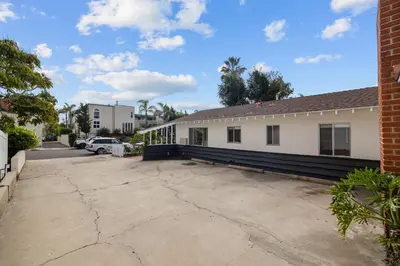 a parking lot in front of a building at Ocean Paradise | Patio, Parking, BBQ, Location! in San Diego