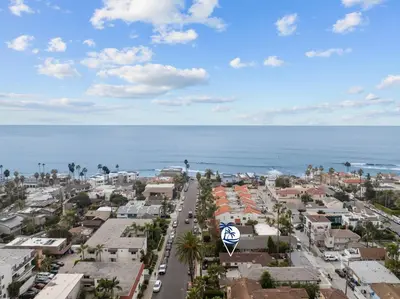 an aerial view of a city and the ocean at Ocean Paradise | Patio, Parking, BBQ, Location! in San Diego