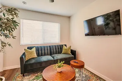 a living room with a couch and a tv at 1BR Close to Downtown SD, Beaches and North Park 1 in San Diego