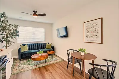 a living room with a couch and a table at 1BR Close to Downtown SD, Beaches and North Park 1 in San Diego