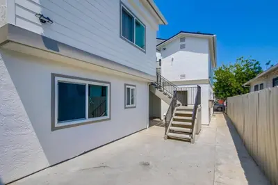a house with a staircase next to a building at 1BR Close to Downtown SD, Beaches and North Park 1 in San Diego